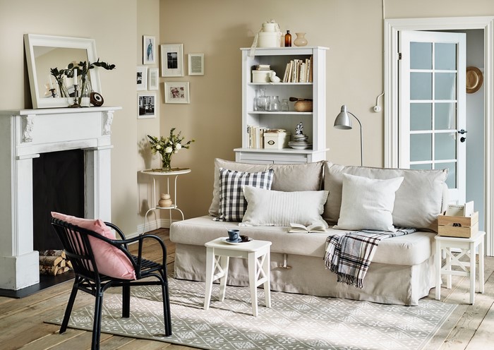 Living room with sofa, chair, and fireplace