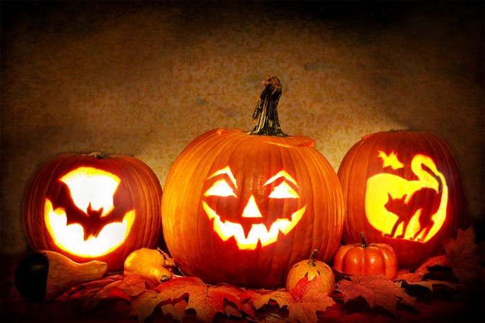 Halloween pumpkins with carved faces and figures