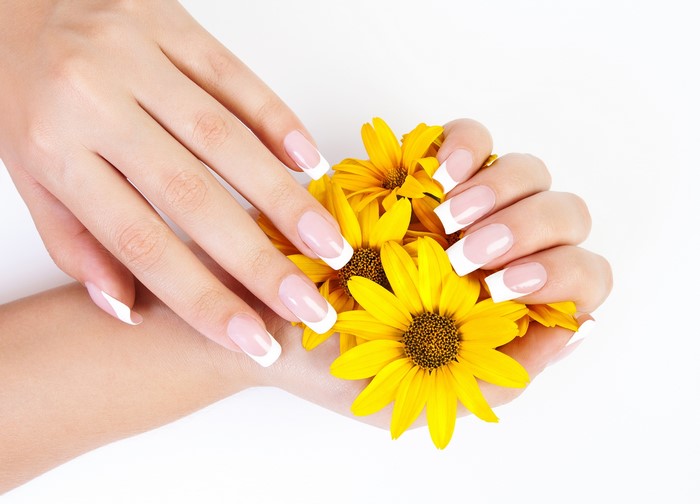 French Manicure Hands with Yellow Flowers