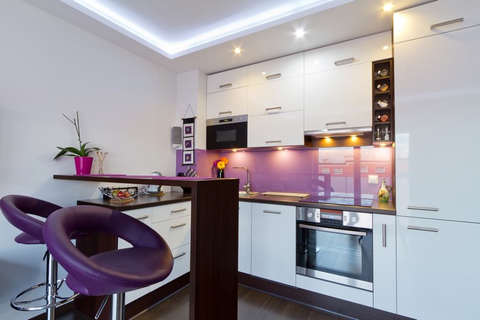 Modern Kitchen with Purple Accents and Bar Stools