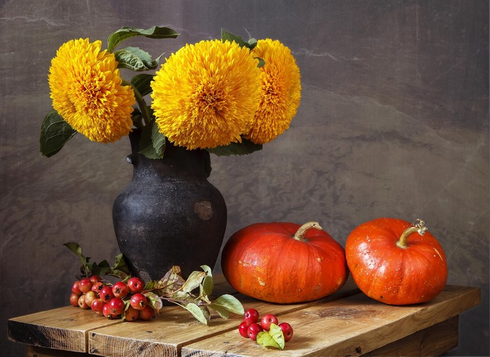 Still life with sunflowers, pumpkins, and crabapples