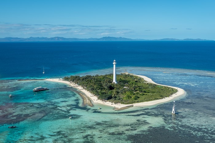 Amedee Lighthouse on a tropical island surrounded by coral reefs