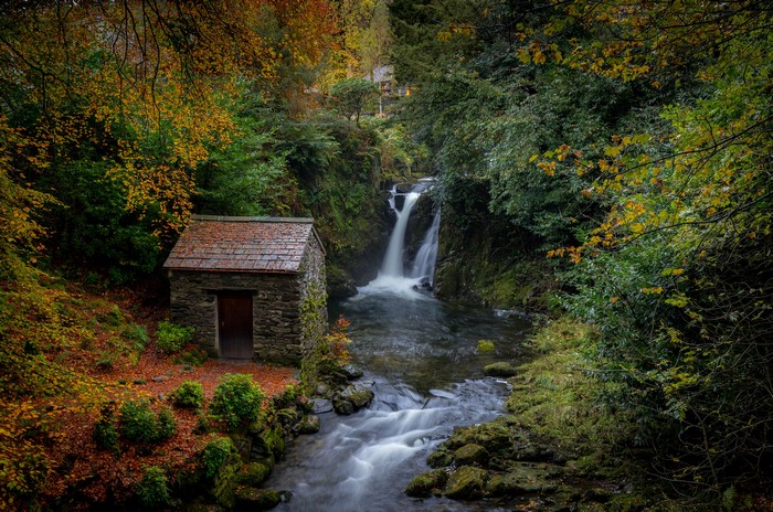 Autumn Waterfall and Stone House in Rydal, Cumbria, UK