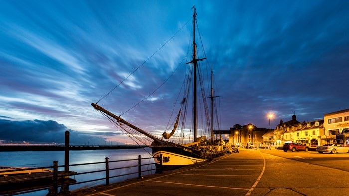 Tall ship docked at Wells next the Sea, England at dusk