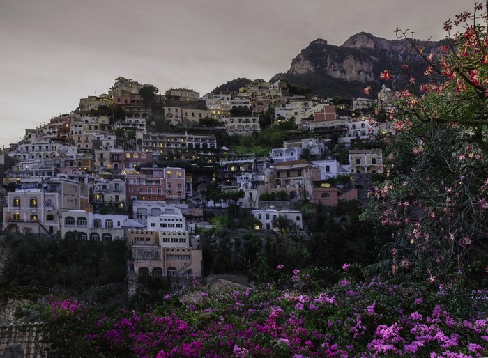 Positano, Italy houses on a hillside at dusk