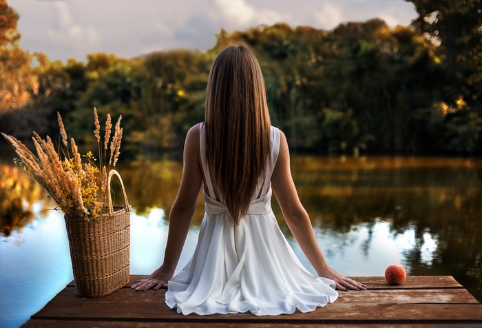 4K Serene Lake View with Woman Sitting