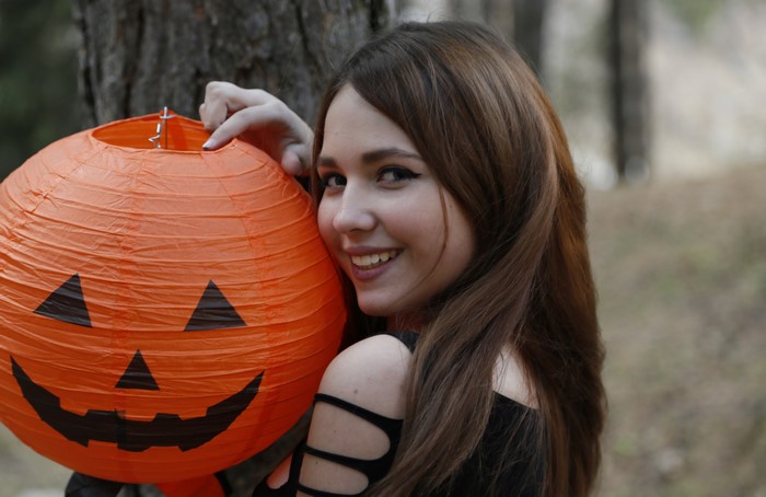 Brown haired girl with Halloween lantern