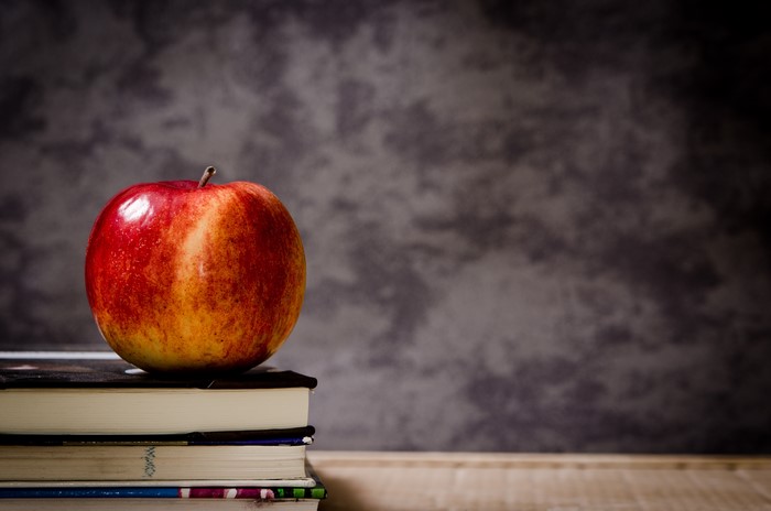 Apple on a stack of books