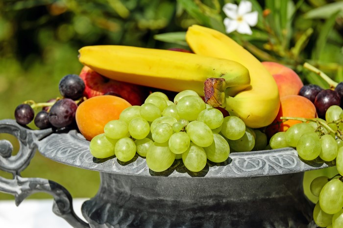 4K Fruit: Bananas, Grapes, and Peaches in a Bowl