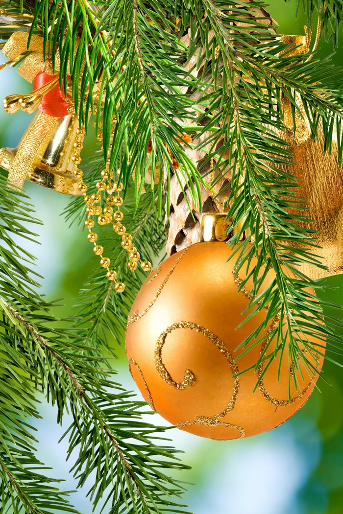 Christmas tree branches with ornaments and bells