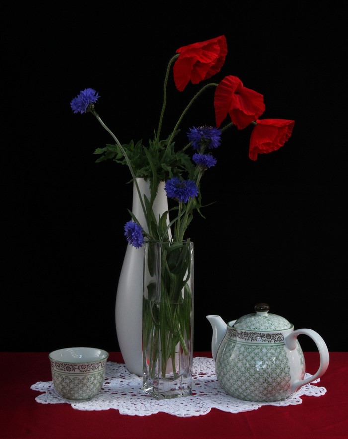 Still-life with poppies, cornflowers, kettle, and cup