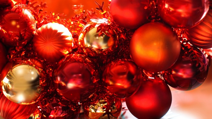 Red and gold Christmas ornaments with tinsel