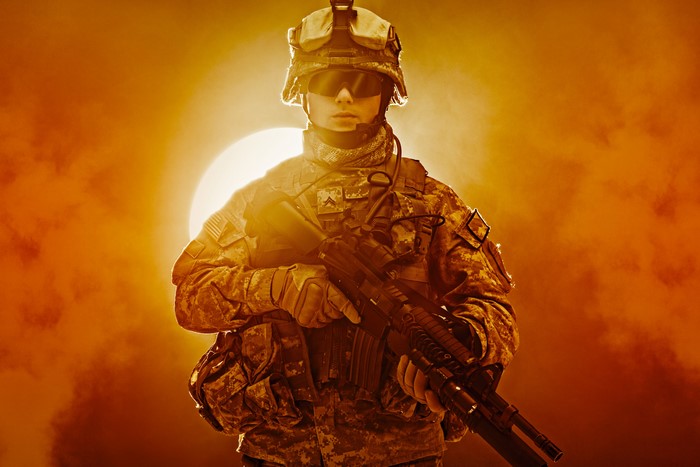 Soldier in uniform with assault rifle