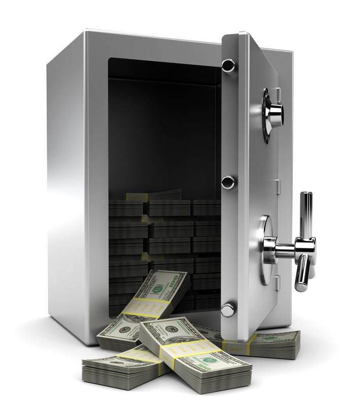 Open safe filled with stacks of US dollar banknotes