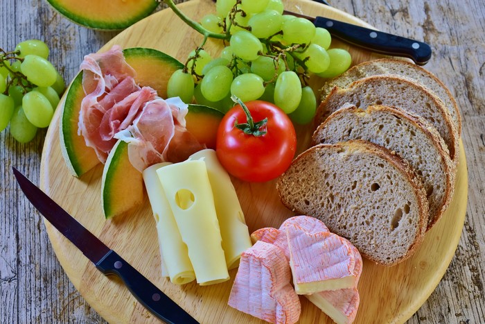Cheese, Ham, Grapes, Bread, Tomato, and Melon Platter