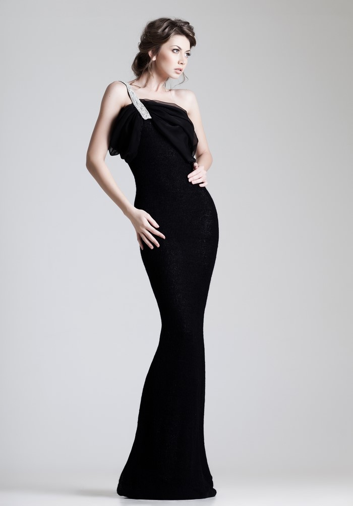 Woman in a black one-shoulder dress