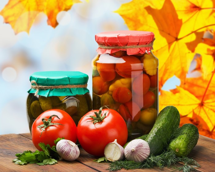 Jars of Pickled Vegetables with Fresh Produce