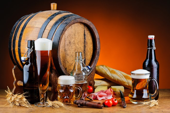 Still life with beer barrel, bread, ham, and tomatoes