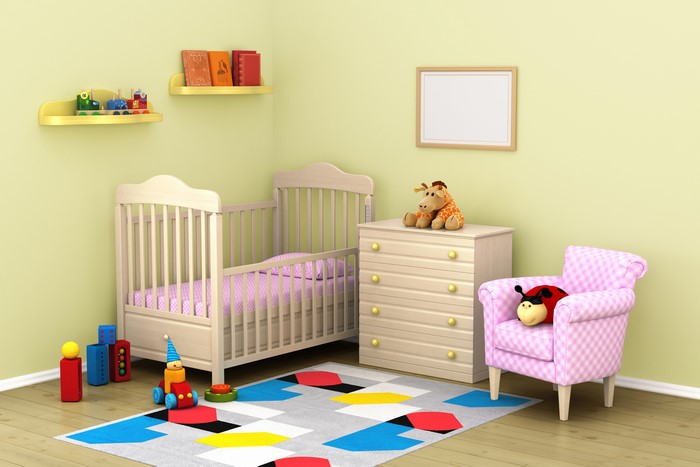 Children's room with crib, armchair, and toys