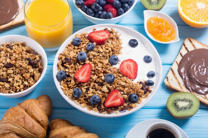 Breakfast with Muesli, Strawberries, Blueberries, and Orange Juice