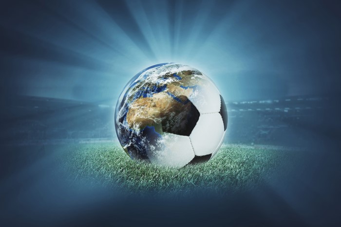 Earth as a soccer ball on a field