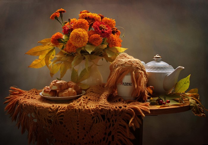 Still life with marigolds, pastries, and teapot