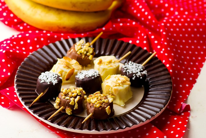 Chocolate-covered banana bites on a plate