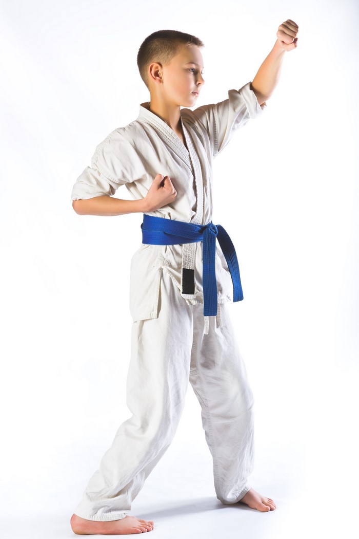 Boy in Karate Uniform with Blue Belt