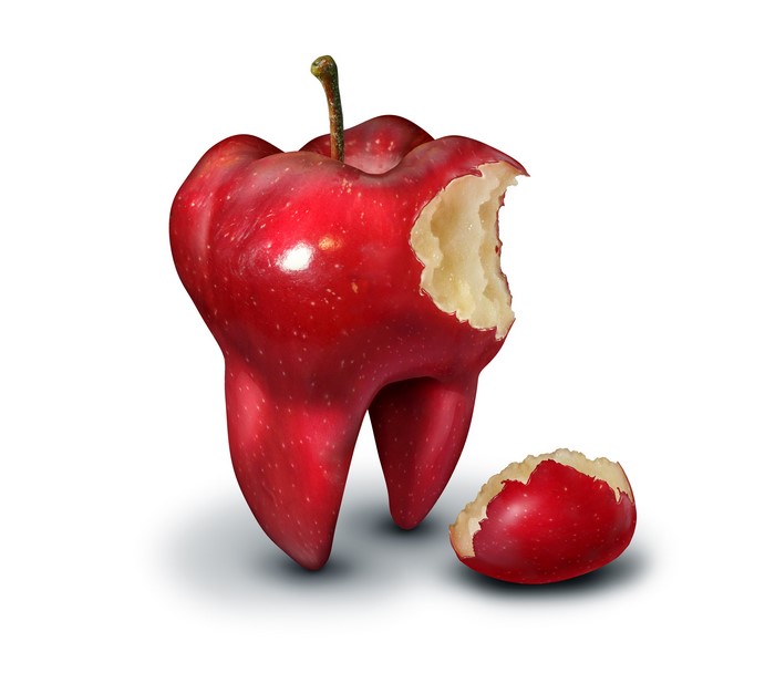 Apple shaped like a tooth with a bite taken out