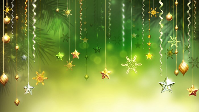 Christmas ornaments and snowflakes on green background