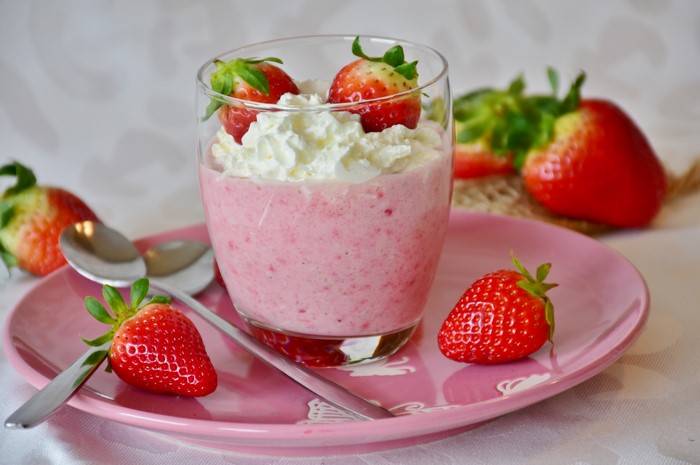 Strawberry dessert with whipped cream and strawberries