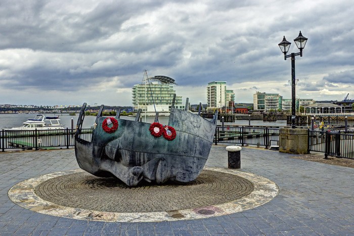 Cardiff Bay monument with buildings and boats