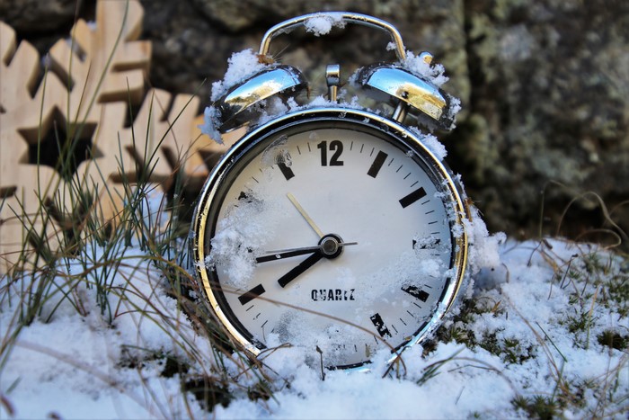 Alarm clock covered in snow