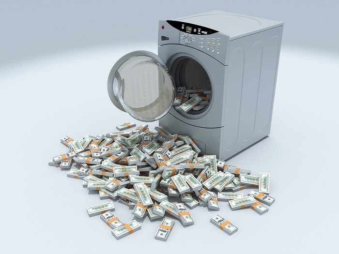 Washing machine with stacks of money