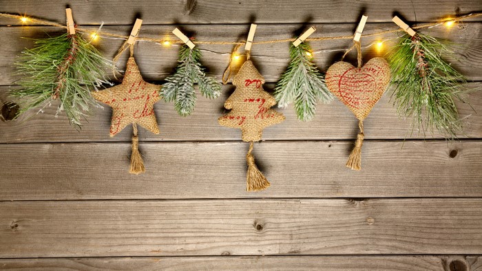 Christmas decorations on wood planks with fairy lights