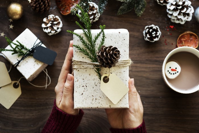 Christmas gifts with pine cones and hot chocolate