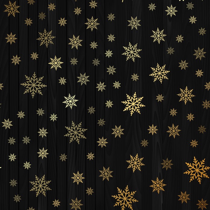 Golden snowflakes on a dark wood texture