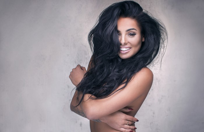 Brunette girl with long dark hair smiling