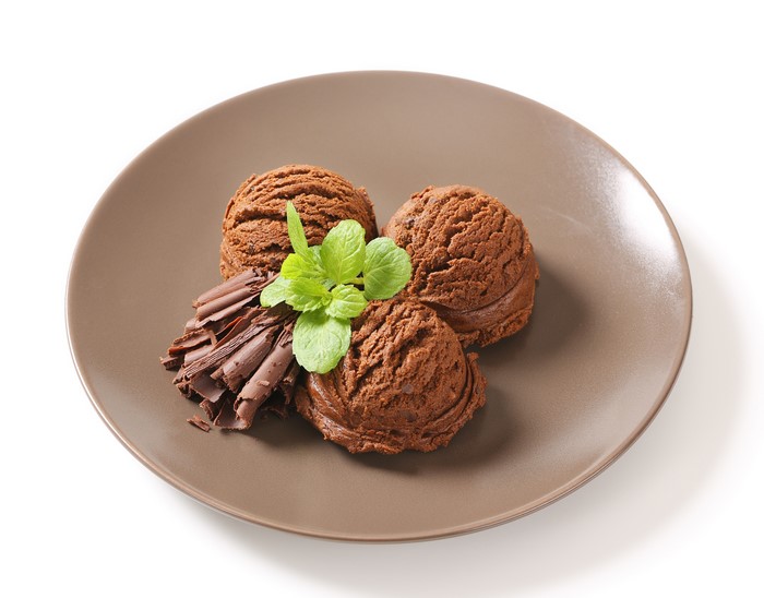 Chocolate ice cream scoops on a plate