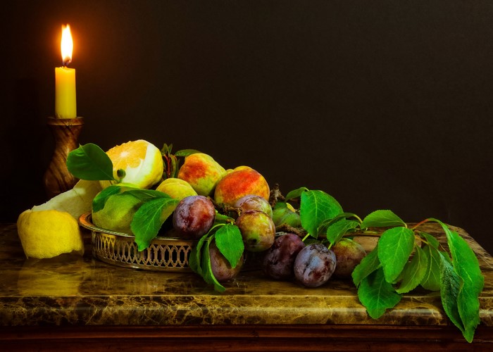 Still life with fruit and candle