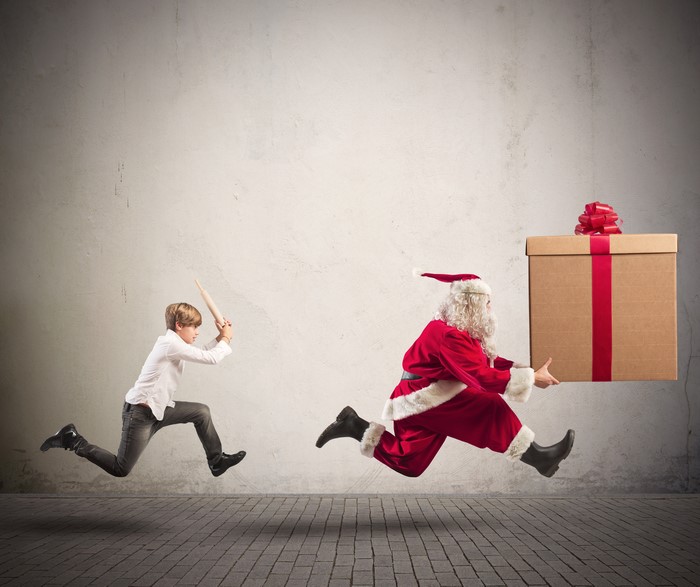 Boy Chasing Santa Claus with a Rolling Pin