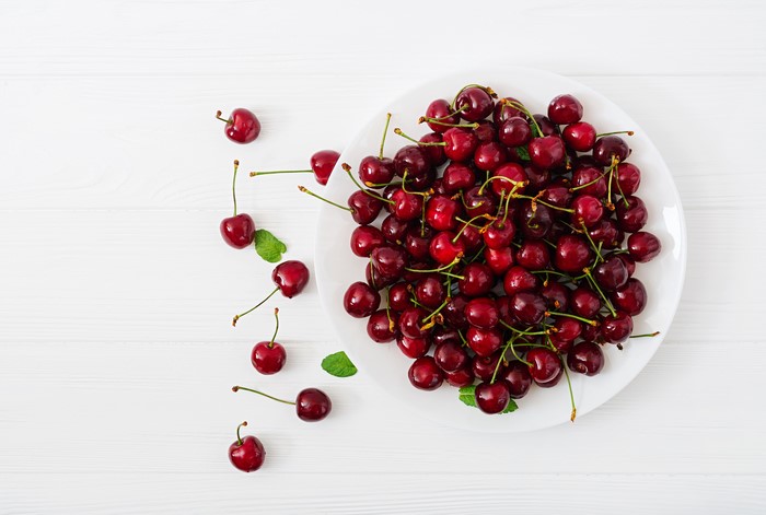 Cherries on a white plate