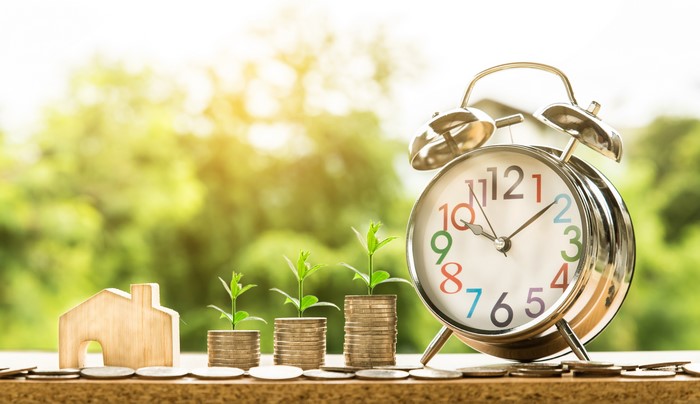 Alarm clock with money and house