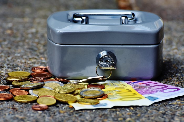 Cash box with Euro banknotes and coins