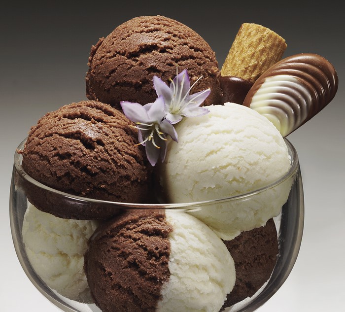 Chocolate and vanilla ice cream scoops with garnishes