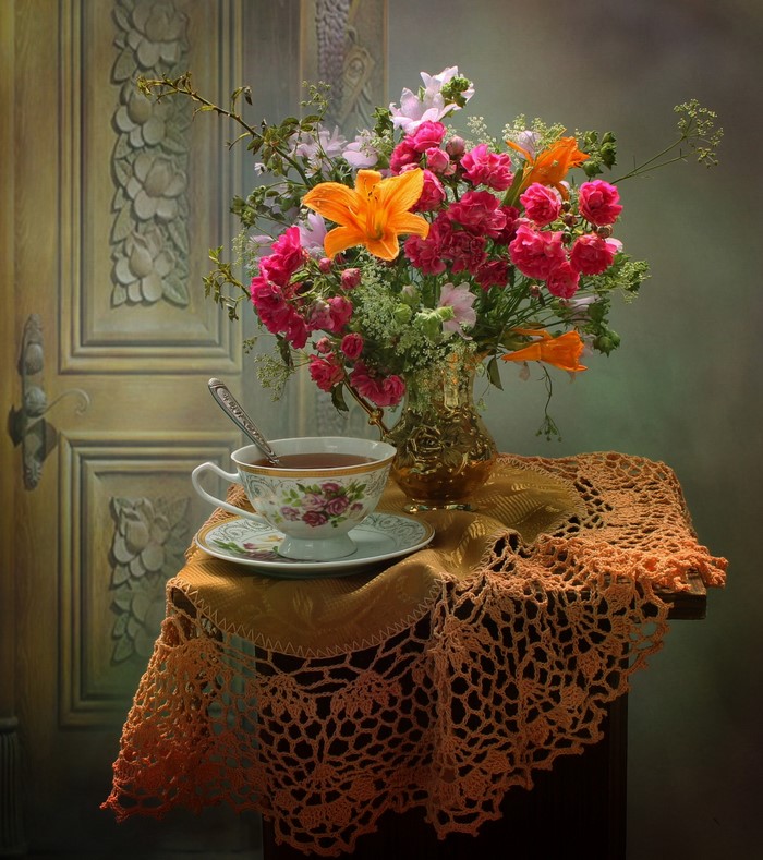 Still life with bouquet and tea cup