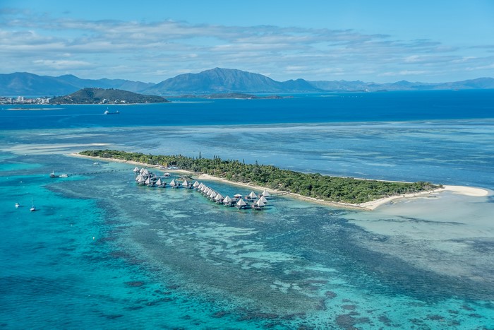 Overwater bungalows on a tropical island in the sea