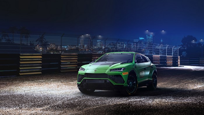 Green Lamborghini Urus ST-X on a Racetrack at Night