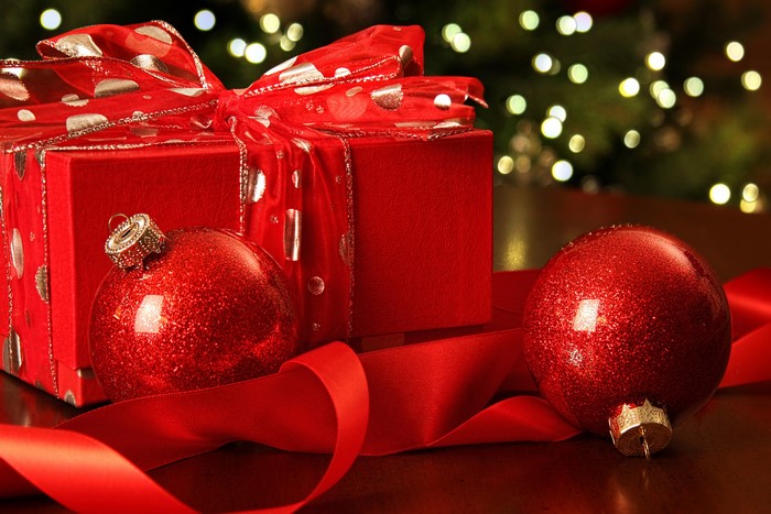 Red Christmas gift with ornaments and ribbon