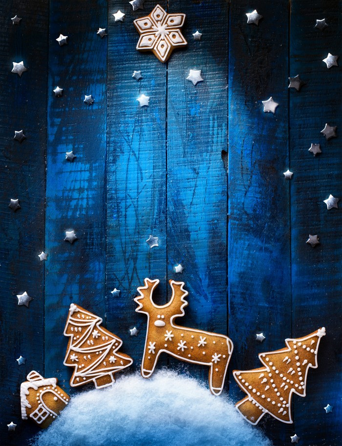 Christmas gingerbread cookies on a blue wooden background